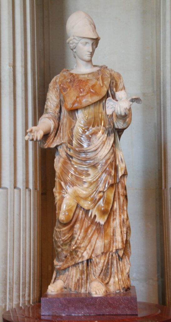 Statue of Athena holding an owl, symbol of wisdom in classical art